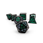 Set of black polyhedral dice with green and purple numbers 