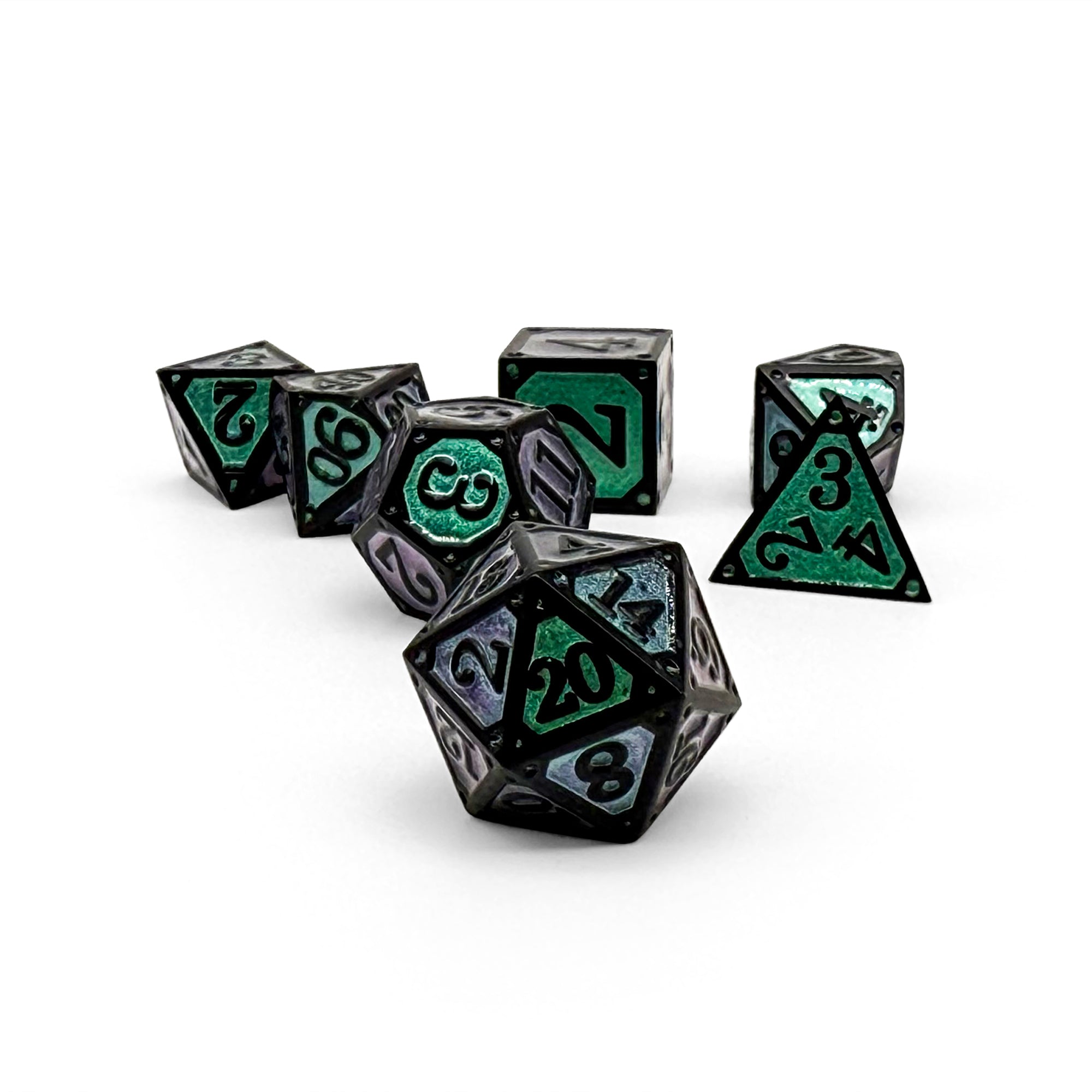 Set of black polyhedral dice with green and purple numbers 